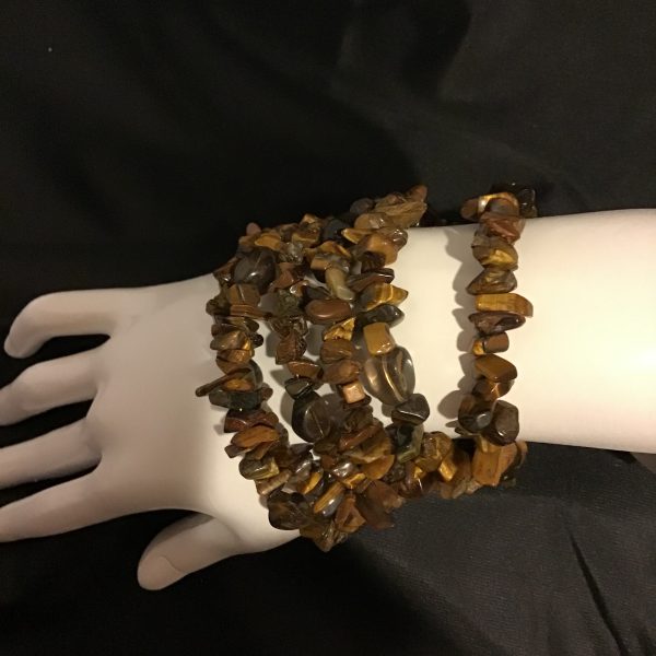 A mesmerizing tiger’s eye chip bracelet set, perfect for layering and adding an earthy, boho-chic touch to any look.