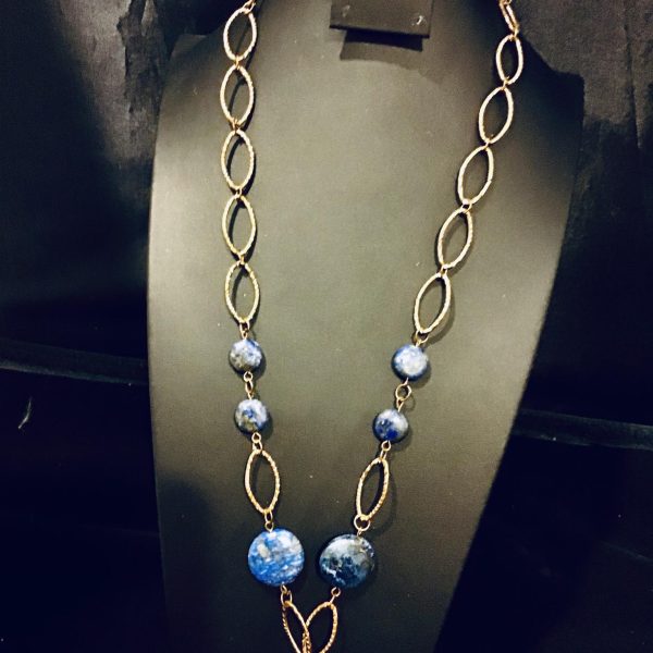 Adorn your neckline with the night sky – "Celestial Echoes" features dreamy, star-splattered beads linked by golden loops, perfect for elevating evening wear or adding sparkle to your daytime ensemble.