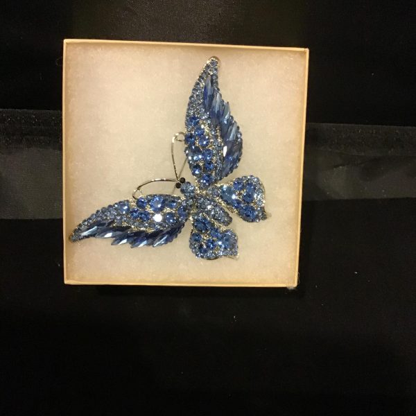 Elevate your style with the "Azure Flutter Brooch," featuring a stunning butterfly adorned with radiant blue rhinestones. Perfect for adding a whimsical yet elegant touch to any outfit.
