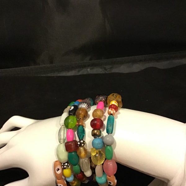 A vibrant, multi-strand wrap bracelet featuring an eclectic mix of colorful beads—perfect for adding a playful boho touch to any outfit.