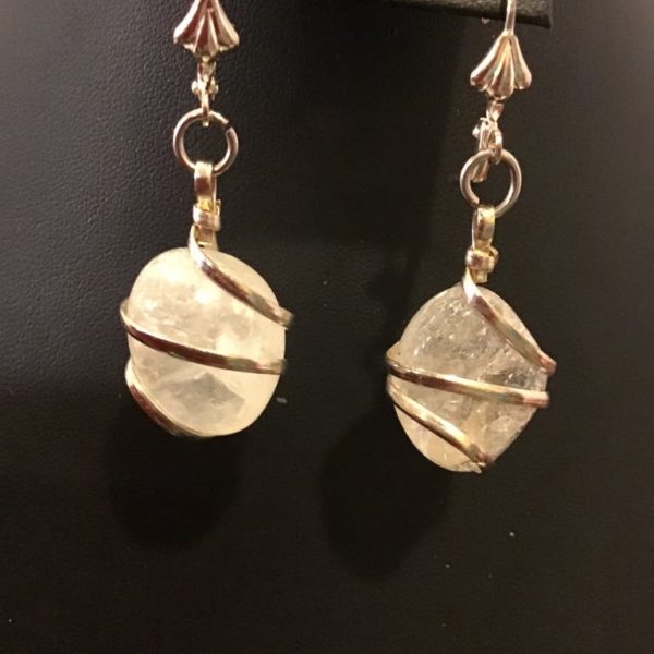 Enchanting crystal-like drop earrings wrapped in delicate metal wire, perfect for adding a touch of celestial elegance to any outfit.