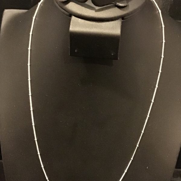 A delicate beaded chain necklace that exudes timeless elegance. Perfect for layering or wearing solo, this minimalist piece complements any outfit effortlessly.