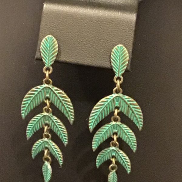 These vintage-inspired chandelier earrings feature a cascade of delicately detailed leaves in a soft patina finish, perfect for adding a touch of nature-inspired elegance to any outfit.