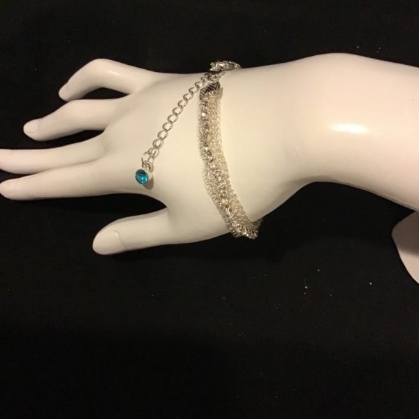 Braided silver-tone chain bracelet with turquoise charm accent—adjustable, elegant, and perfect for layering.