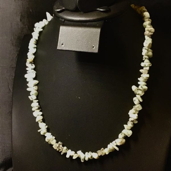 Cool-toned chip beads in minty hues create a soft, earthy necklace with effortless boho charm and vintage flair.